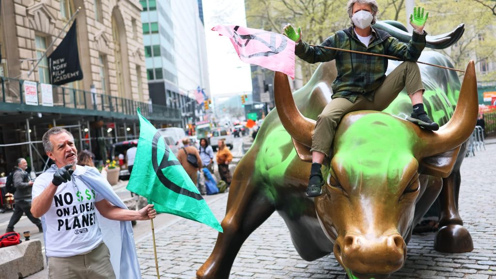 Charging Bull Statue in Wall Street Vandalized by Climate Activists